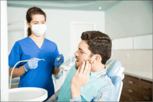 Emergency dentist near me in Ubud – patient receiving urgent dental treatment at Nusa Medica Dental Care with professional dentist assistance.