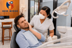Tooth Pain Relief in Bali – dentist examining a patient with toothache at Nusa Medica Dental Care clinic in Bali.